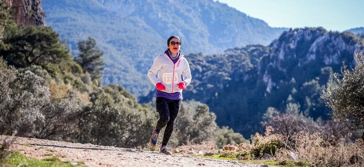 Woman running in the natural beauty of Izmir mountains, Turkey.