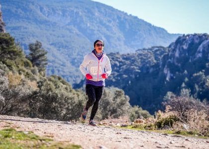 Woman running in the natural beauty of Izmir mountains, Turkey.